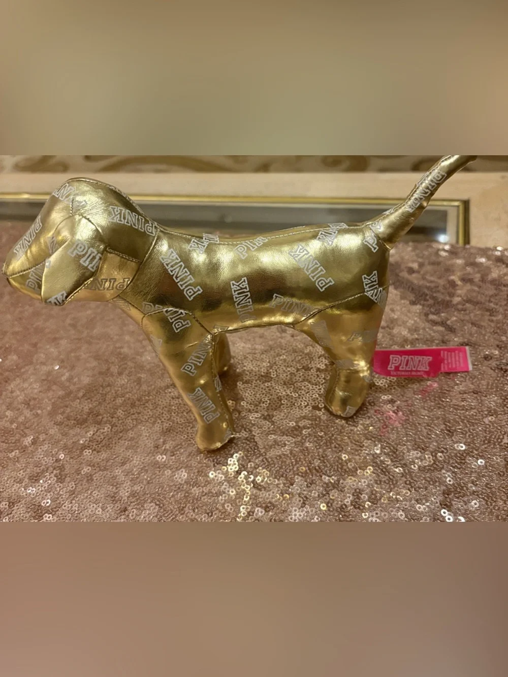 Victoria’s Secret PINK gold metallic dog w/allover logo. 6” high x 10” wide appr